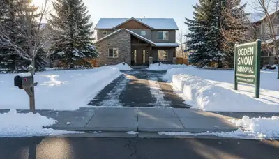 Cleared residential driveway after professional snow removal by Chop Chop Landscaping in Ogden, UT
