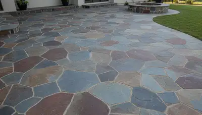 Flagstone patio with natural slate pavers expertly installed by landscaping pros in Ogden, Utah